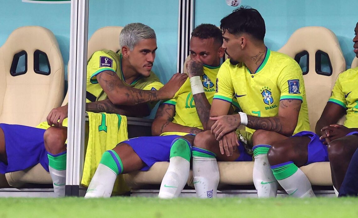 Brazil striker Neymar looks upset on the bench