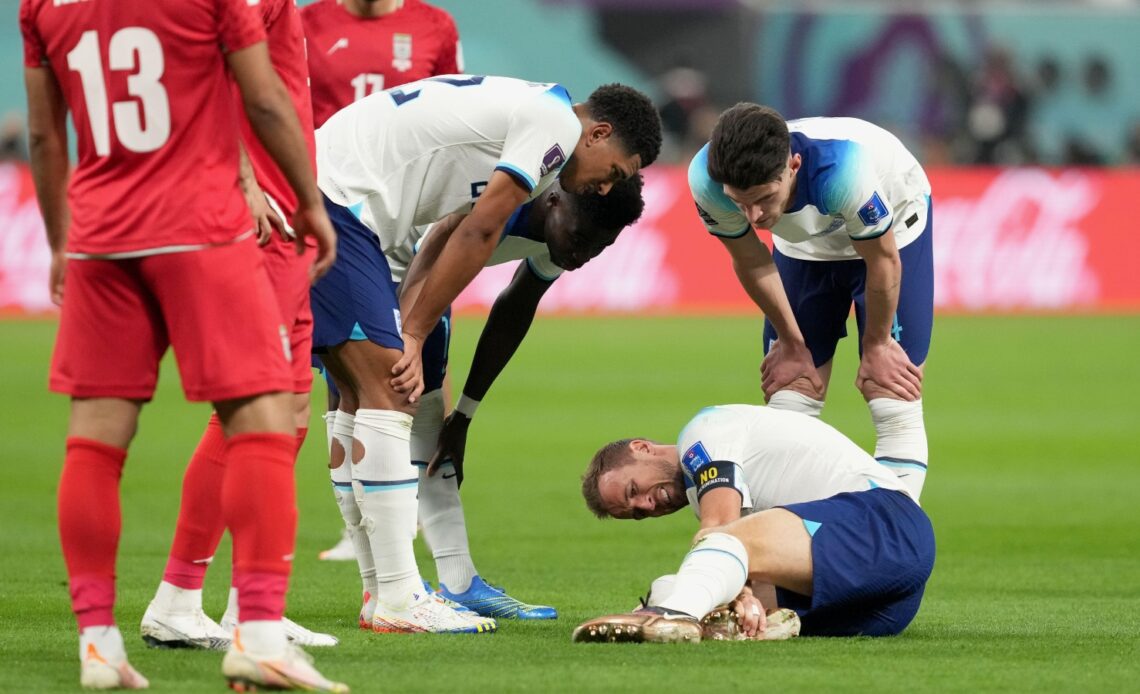 England captain Harry Kane holds his ankle
