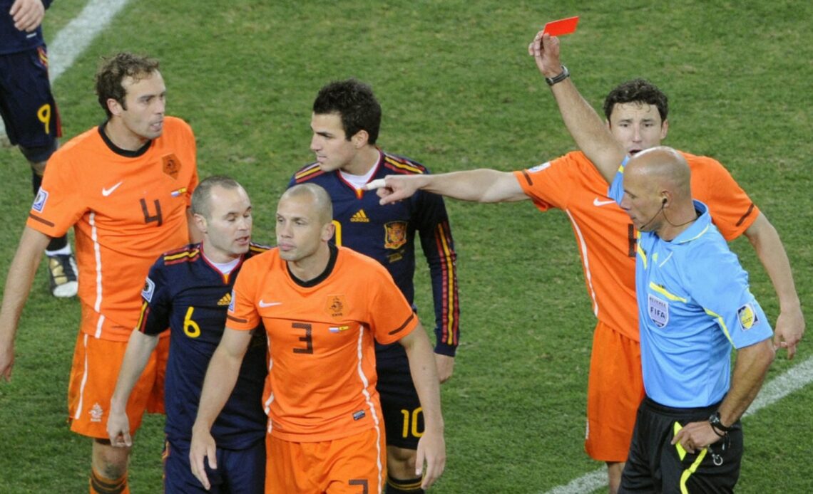 Ex-Netherlands defender Johnny Heitinga is shown a red card