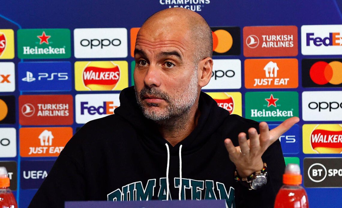Manchester City manager Pep Guardiola talks to the media