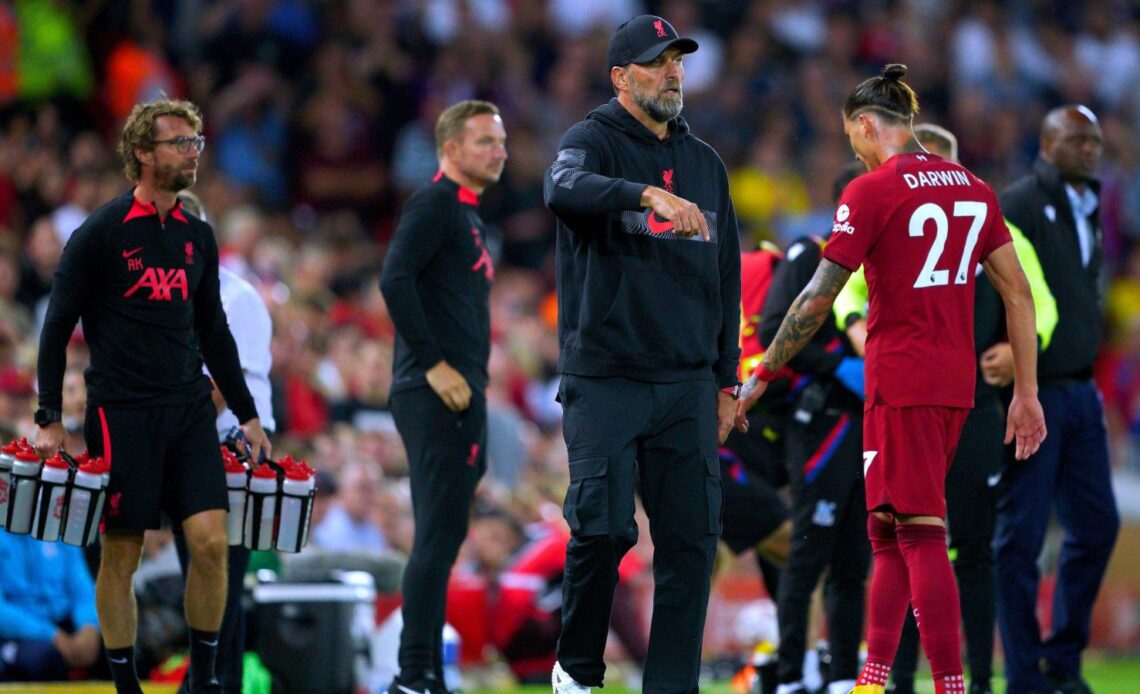 Liverpool striker Darwin Nunez walks past Jurgen Klopp