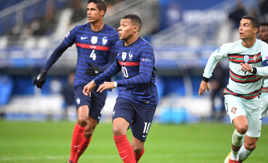 Kylian Mbappe and Cristiano Ronaldo during a match