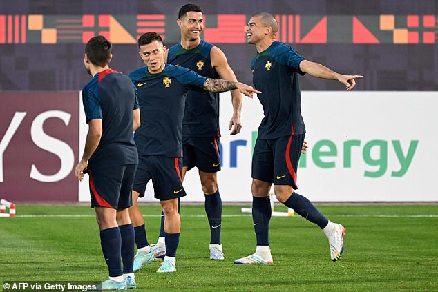 But an apparently relaxed Ronaldo laughed and joked with team-mates (pictured) ahead of Saturday's crunch quarter-final tie against African side Morocco, who beat Spain in the last 16