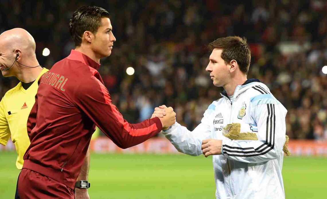 Lionel Messi and Cristiano Ronaldo shake hands before a match