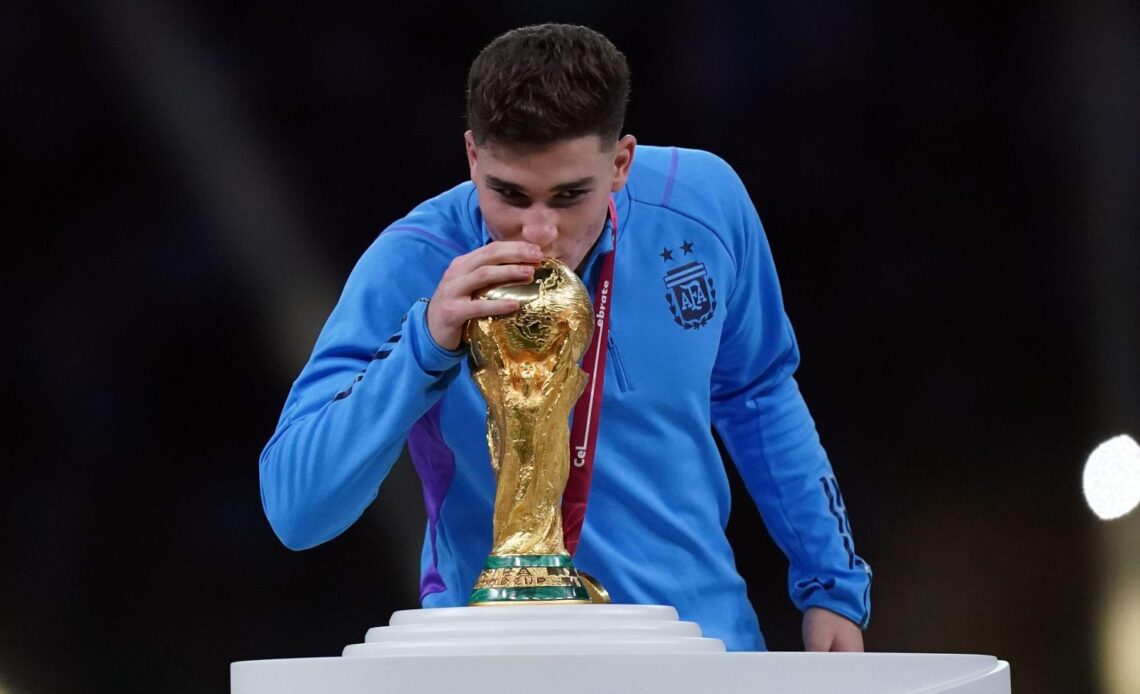 Man City striker Julian Alvarez kisses the World Cup trophy