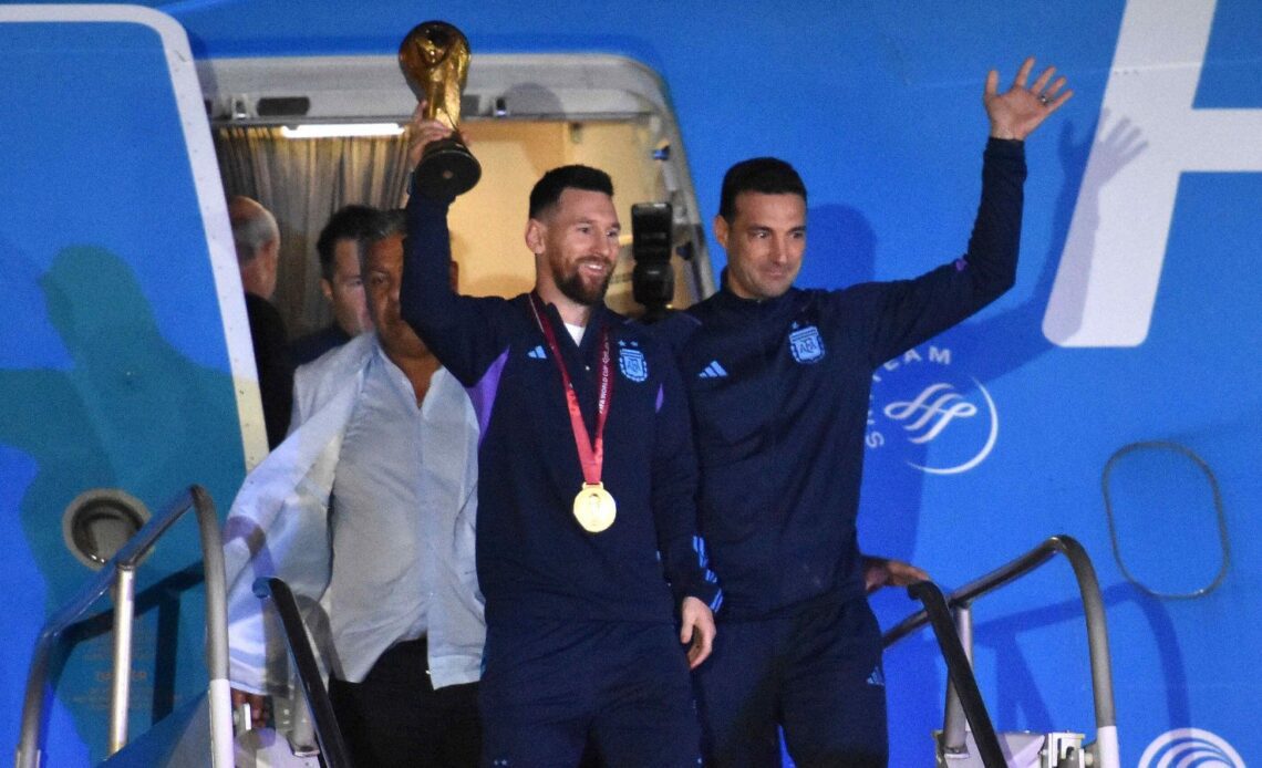 Lionel Messi gets off a plane