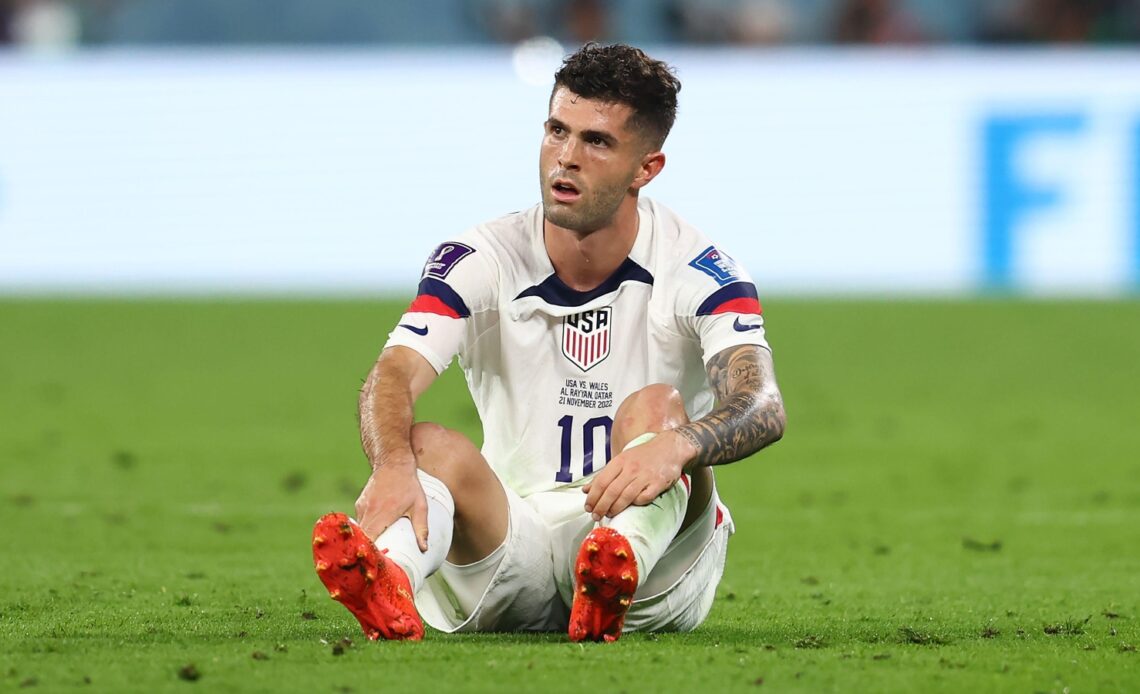 Reported Newcastle target Christian Pulisic sits on the ground during a match for the USA