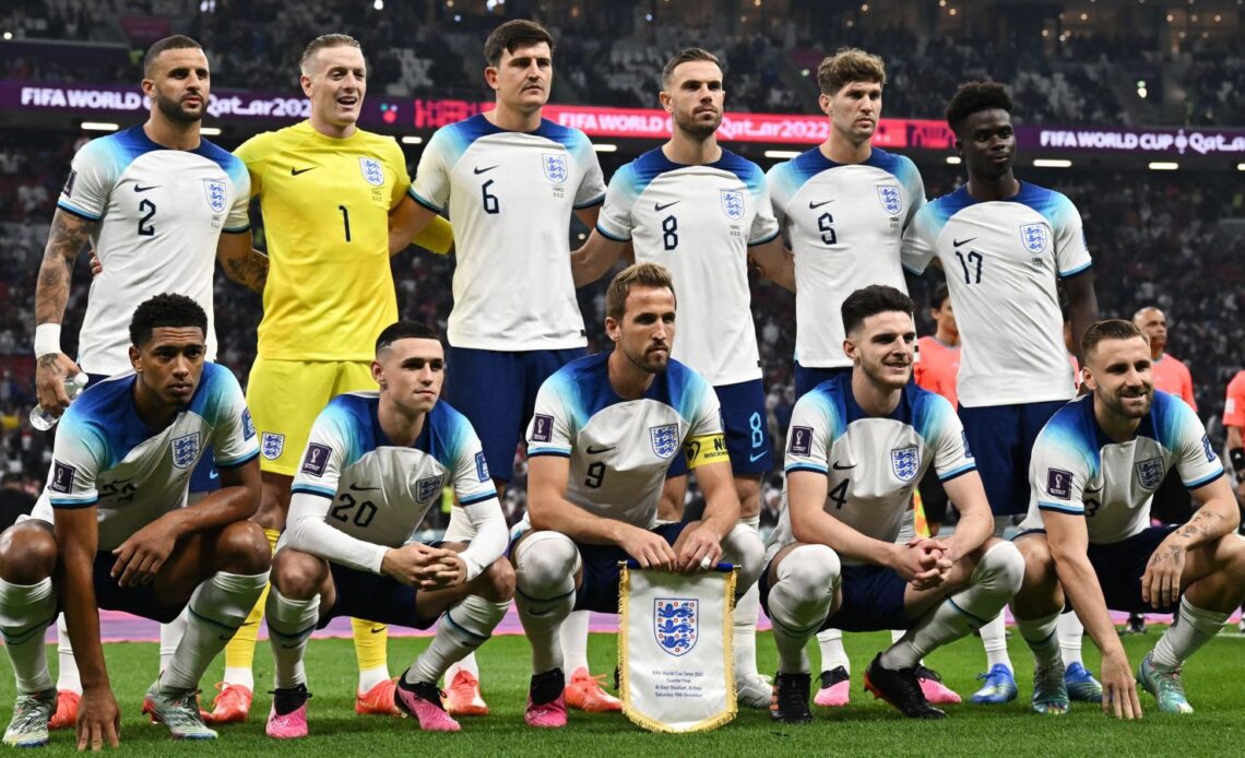 England pose for a team photo ahead of the 2022 World Cup quarter-final against France