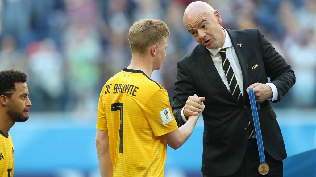 Gianni Infantino presents Kevin De Bruyne with his medal after the third-place play-off at the 2018 FIFA World Cup.