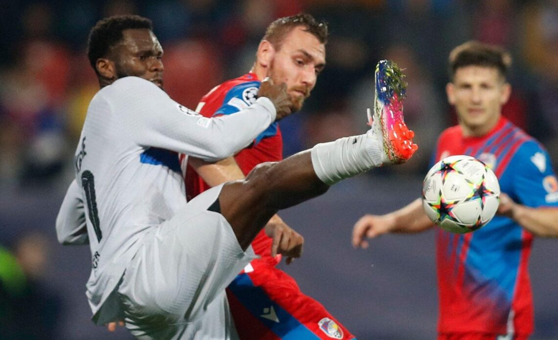 Tottenham target Franck Kessie tackles an opponent