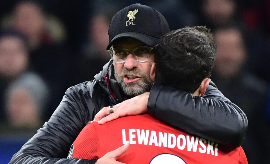 Liverpool boss Jurgen Klopp and Robert Lewandowski hug