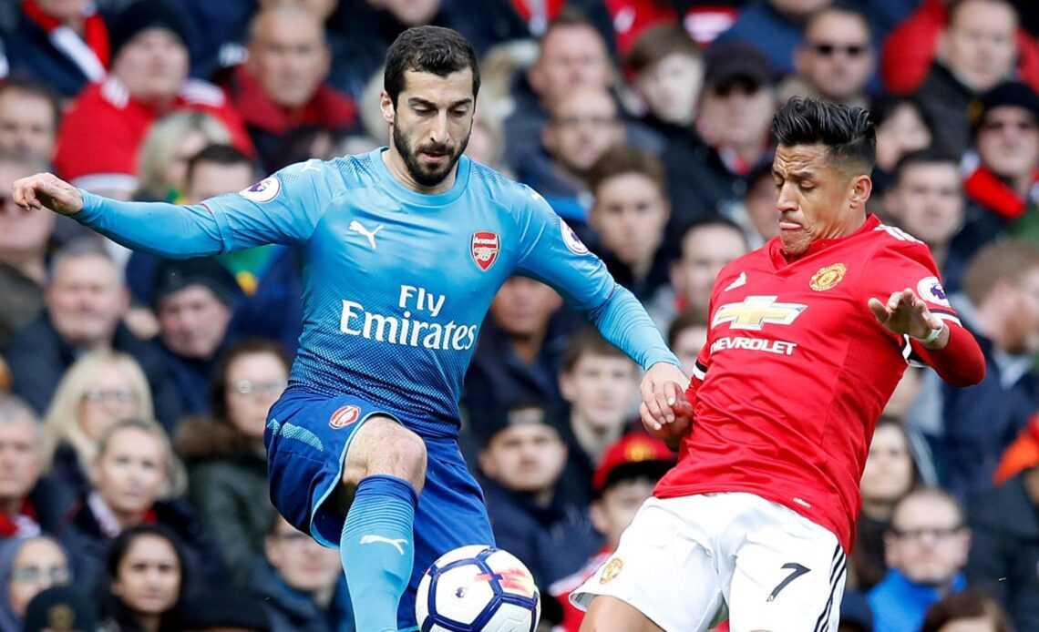 Arsenal's Henrikh Mkhitaryan and Alexis Sanchez compete for the ball