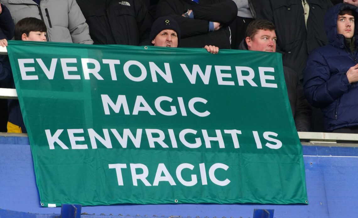 Everton fans hold a banner protesting against chairman Bill Kenwright.