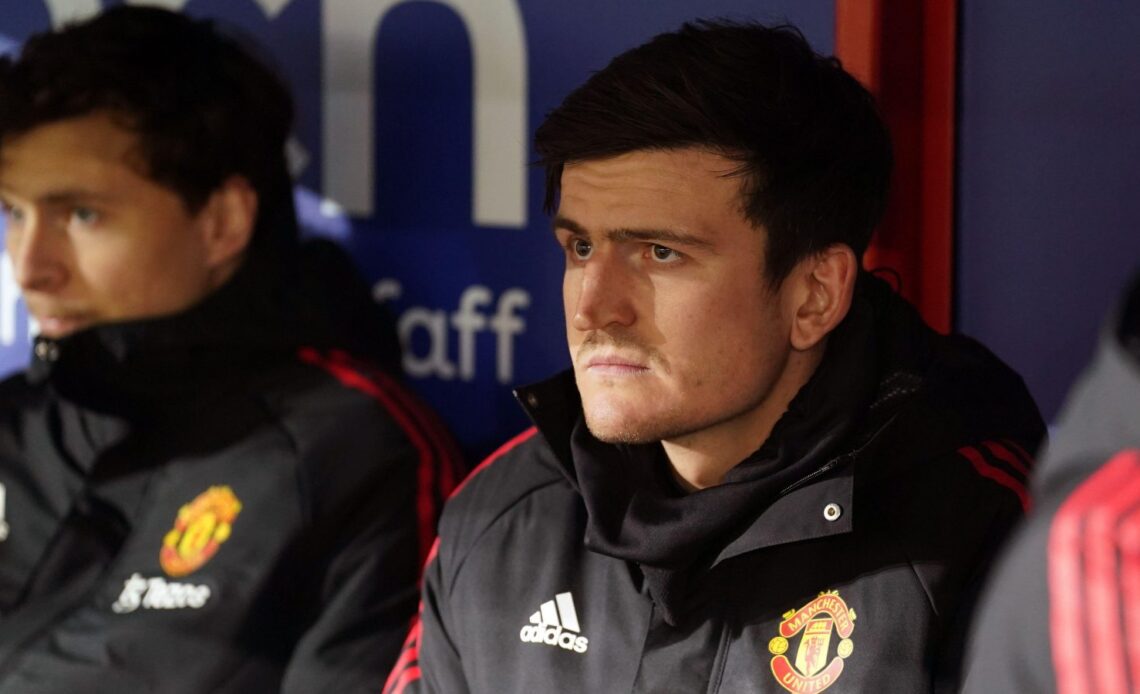 Man Utd defender Harry Maguire looks unhappy on the bench
