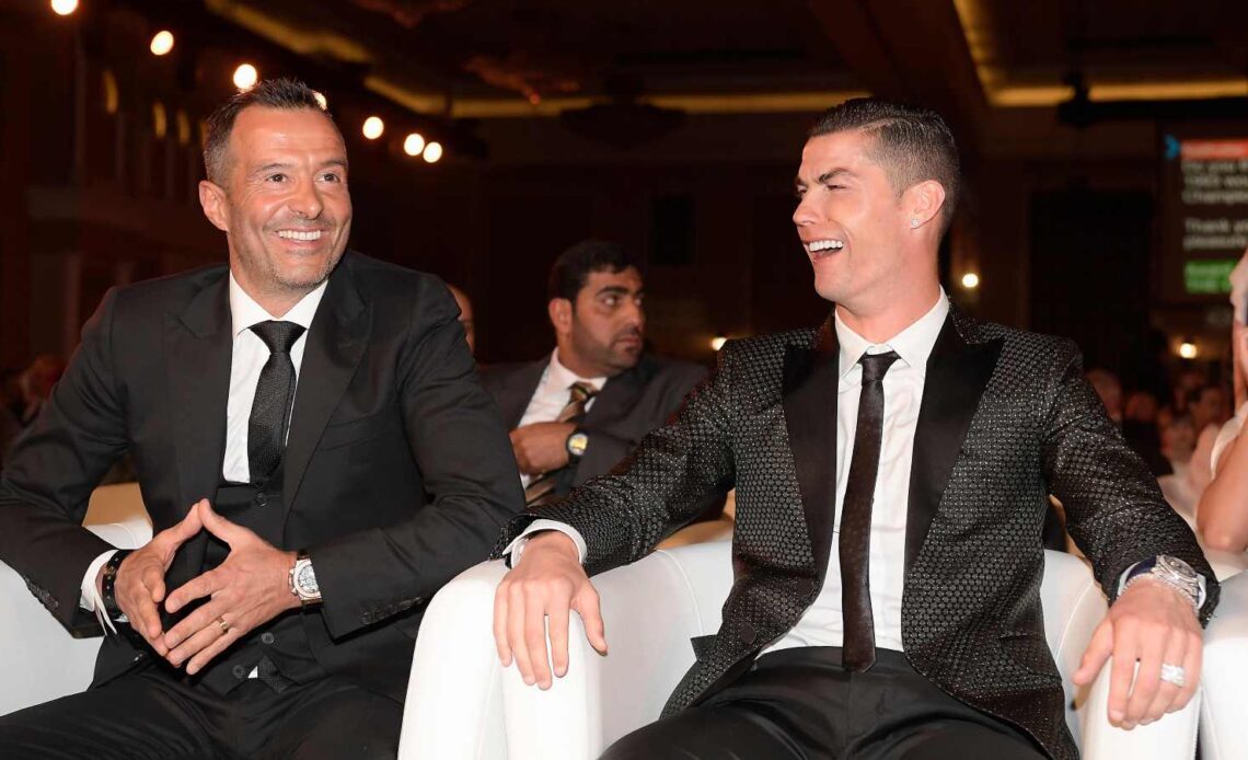 Cristiano Ronaldo laughs with Jorge Mendes