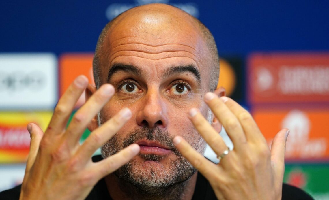 Man City boss Pep Guardiola makes a gesture