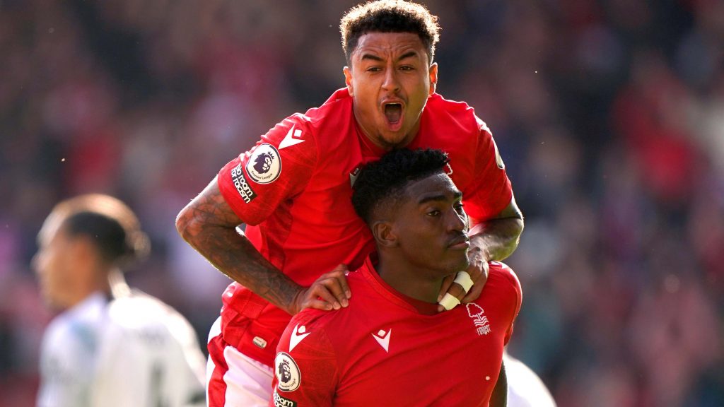 Nottingham Forest's Taiwo Awoniyi celebrates with team-mate Jesse Lingard after scoring against Liverpool.
