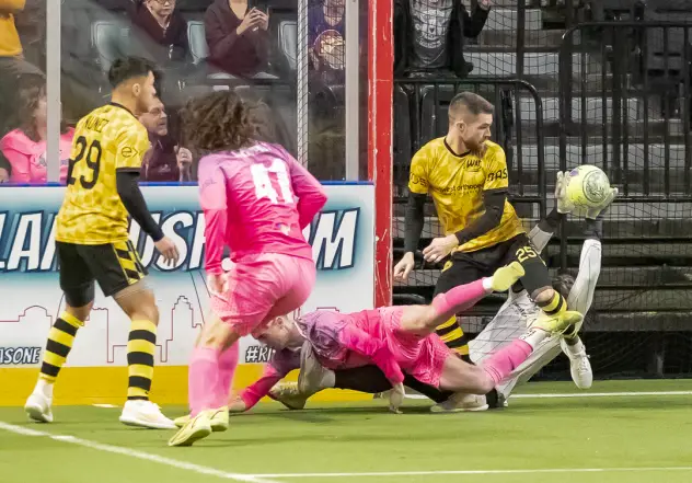 St. Louis Ambush's Brian Bement and Milwaukee Wave's and Slavador Nunez and Andrew Wiedabach on the field