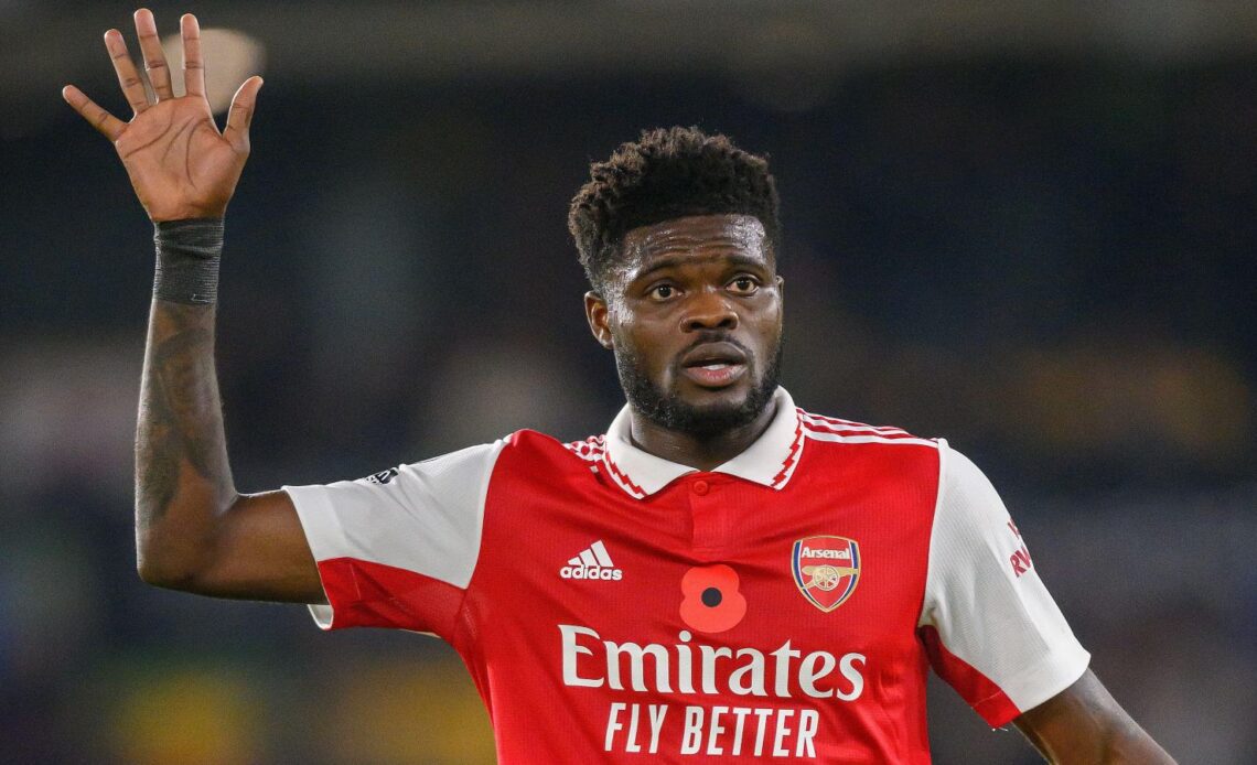Arsenal midfielder Thomas Partey puts his hand up in the air