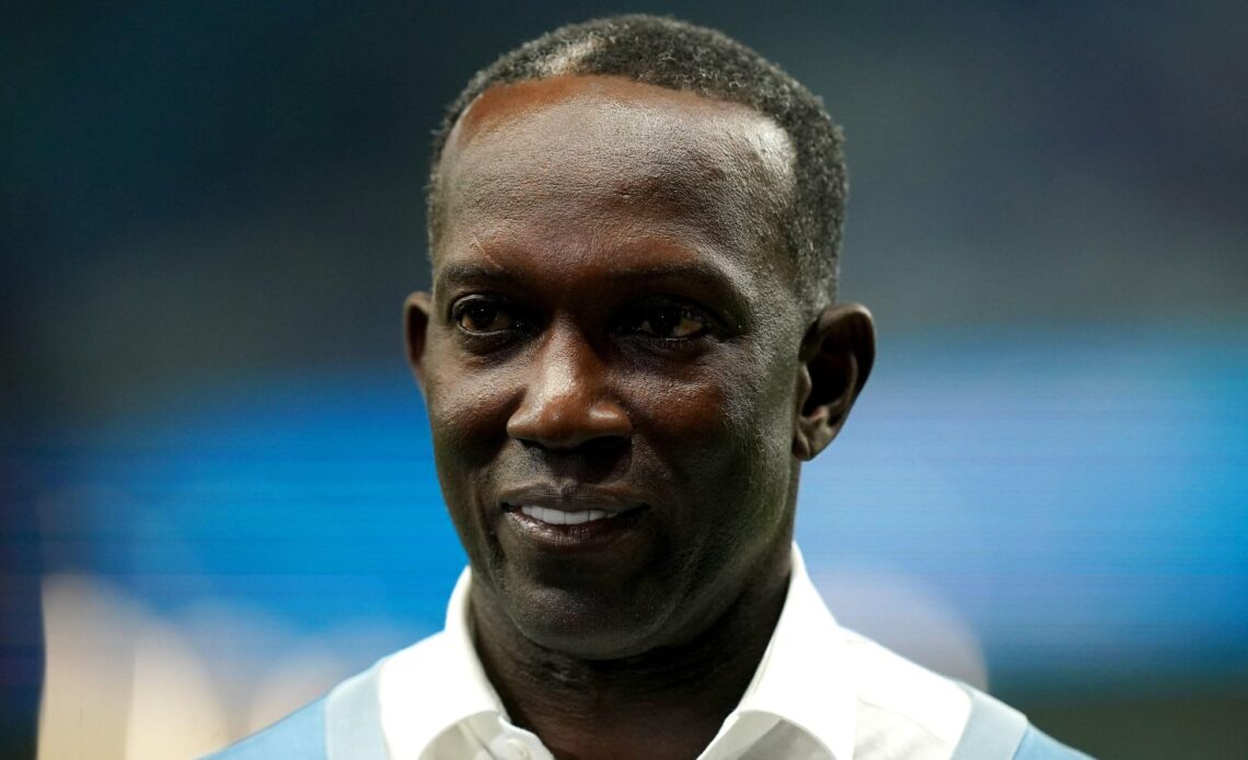 Former Man Utd striker Dwight Yorke looks towards the stands