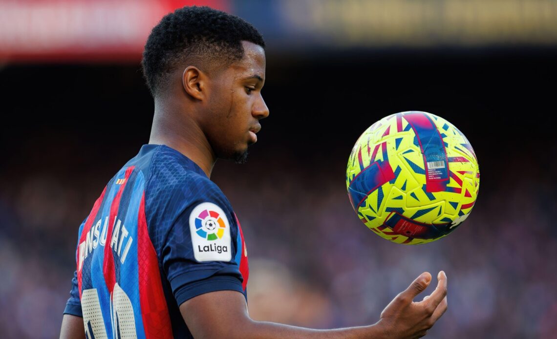 Barcelona winger Ansu Fati catches the ball