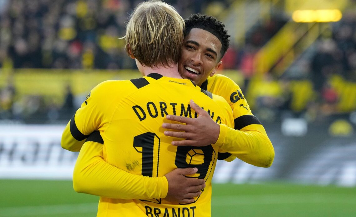 Jude Bellingham and Julian Brandt celebrate after a Borussia Dortmund goal.