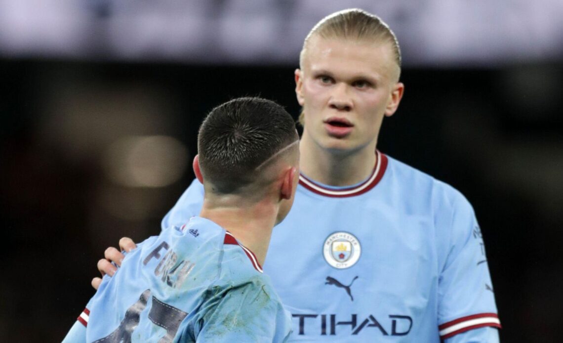 Manchester City forward Phil Foden talks to teammate Erling Haaland