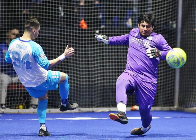 Florida Tropics goalkeeper Jorge Navarrete challenges Utica City's Rafa Godoi