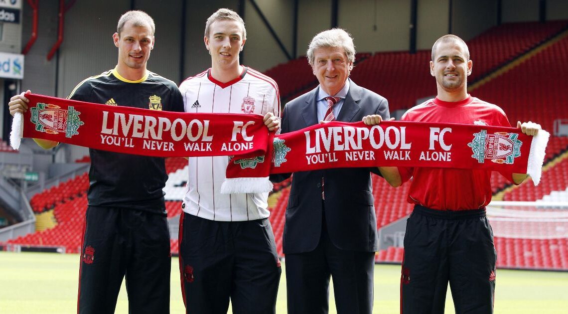 Liverpool manager Roy Hodgson poses with a trio of new signings - Joe Cole, Danny Wilson and Milan Jovanovic - during the summer 2010 window.