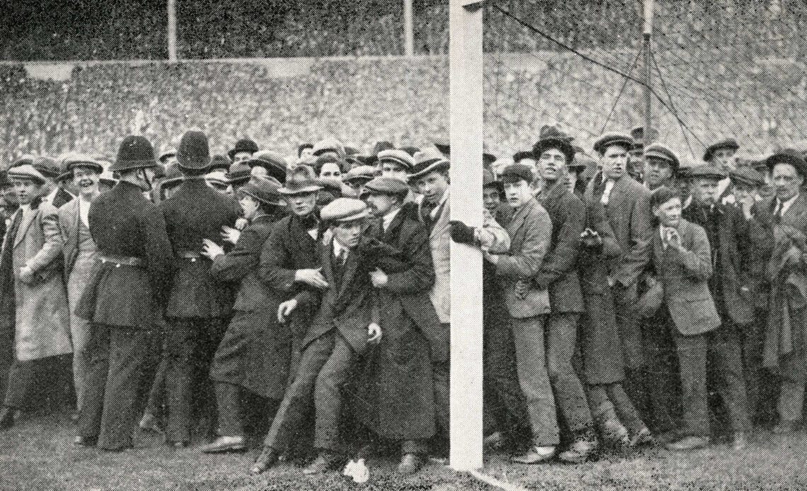 Fans on the pitch at the 1923 FA Cup Final between West Ham and Bolton Wanderers