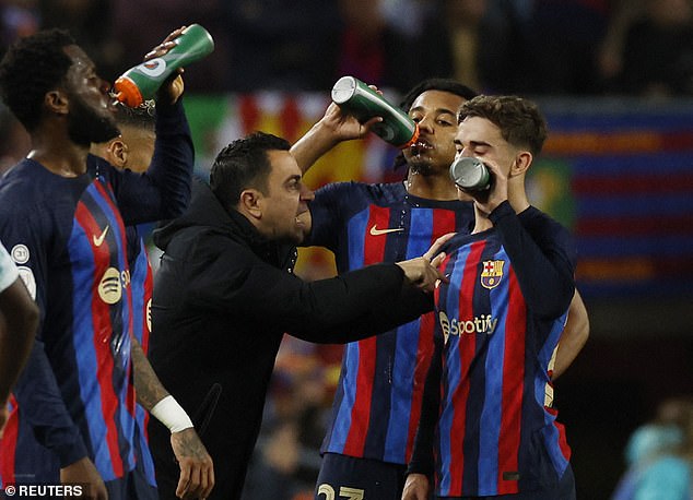 Gavi (right) has told Barcelona boss Xavi (2nd left) he has no intention of leaving the club