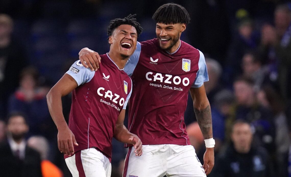 Aston Villa striker Ollie Watkins laughs with Tyrone Mings