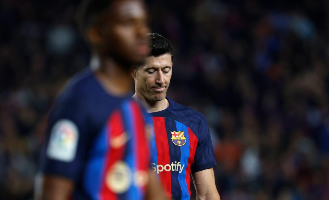 Barcelona striker Robert Lewandowski looks dejected during a match