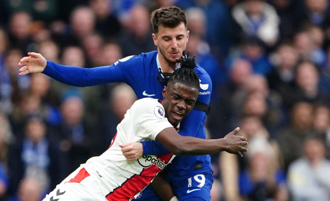Romeo Lavia competes for the ball with Chelsea player Mason Mount