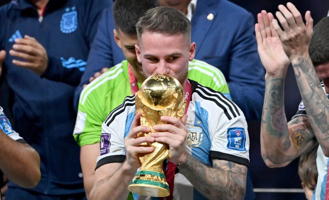 Liverpool target Alexis Mac Allister kisses the World Cup trophy