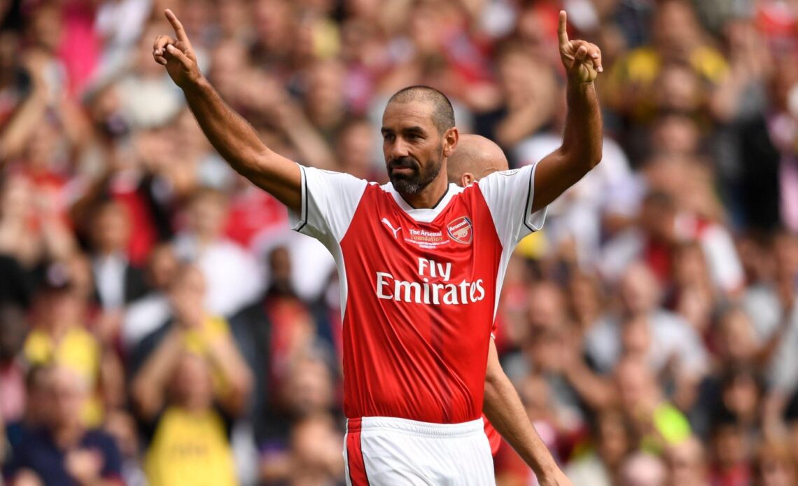 Arsenal winger Robert Pires salutes the crowd