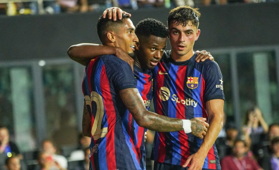 Reported Newcastle United target Raphinha celebrates a goal with his Barcelona teammates Ansu Fati and Pedri during a pre-season friendly in Florida
