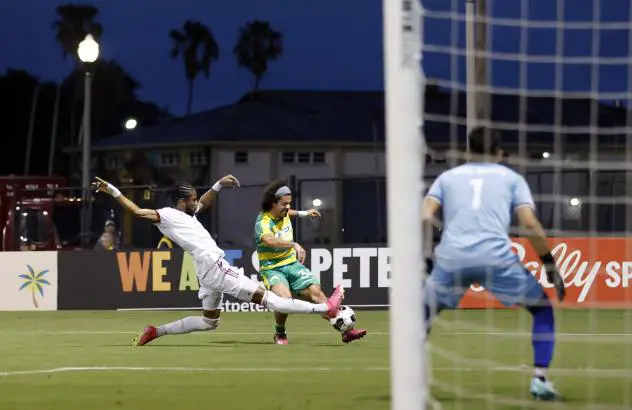 Phoenix Rising FC and the Tampa Bay Rowdies in action