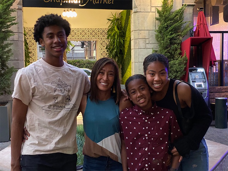 Santiago Hopkins with Mom and Sisters