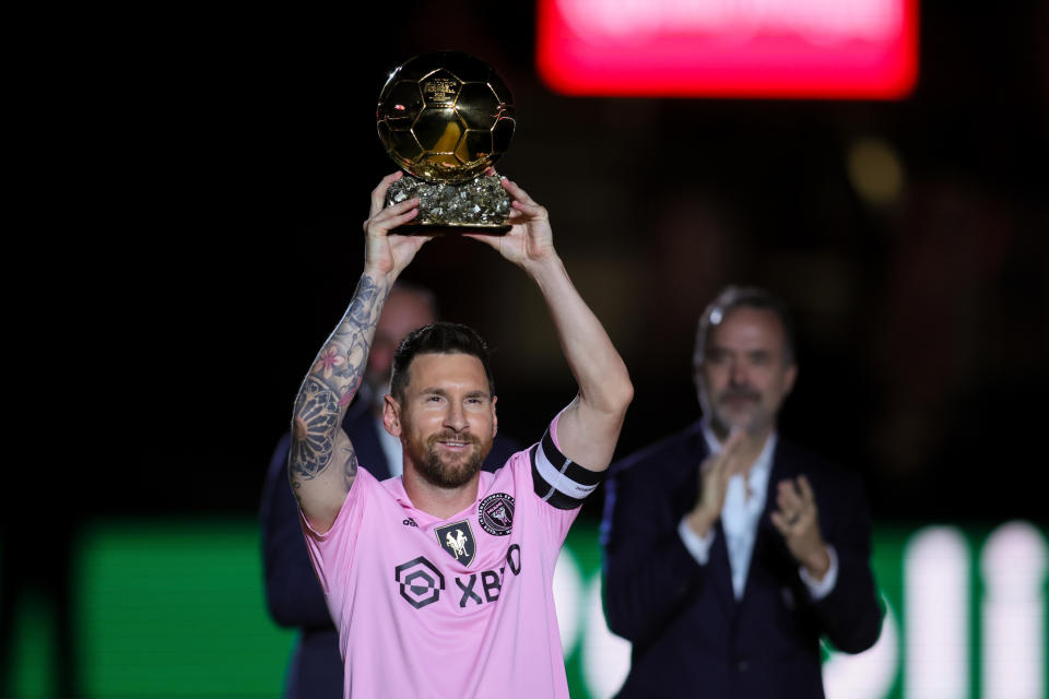 Nov 10, 2023; Lauderdale, FL, USA; Inter Miami forward Lionel Messi (10) poses with the Ballon d'Or trophy before the game against New York City at DRV PNK Stadium. Mandatory Credit: Sam Navarro-USA TODAY Sports