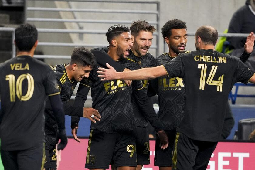 LAFC forward Denis Bouanga celebrates with teammates after scoring during a conference semifinal victory.