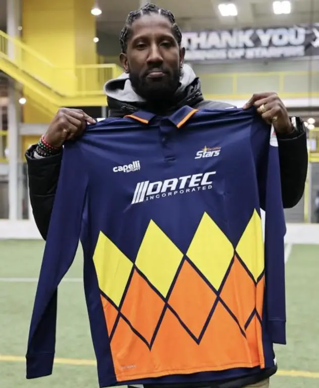 Marcus Trufant holds a Tacoma Stars jersey