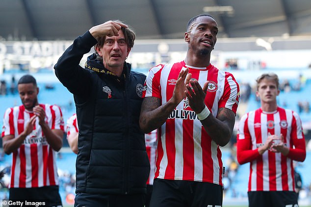 Thomas Frank (left) is desperate to keep Ivan Toney (right) at Brentford this season