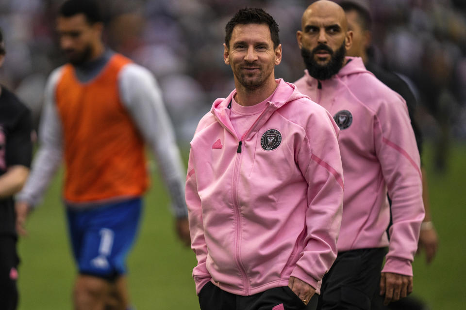 Inter Miami's Lionel Messi, center, looks on after the first half of the friendly football match between Hong Kong Team and US Inter Miami CF at the Hong Kong Stadium in Hong Kong, Sunday, Feb. 4, 2024. (AP Photo/Louise Delmotte)