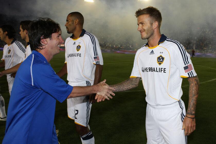 PASADENA, CA - AUGUST 01: David Beckham #23 of the Los Angeles Galaxy and Lionel Messi.
