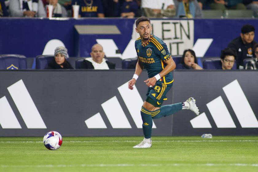 LA Galaxy midfielder Mark Delgado (8) controls the ball against the Vancouver Whitecaps during the second half of an MLS soccer match in Carson, Calif., Saturday, March 18, 2023. (AP Photo/Ringo H.W. Chiu)