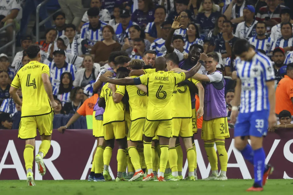 United States' Columbus Crew players congratulate teammate Diego Rossi after scoring a goal against Monterrey, during a CONCACAF Champions Cup semifinal second leg soccer match at the BBVA stadium in Monterrey, Mexico, Wednesday, May 1, 2024. (AP Photo/Alberto Lopez)