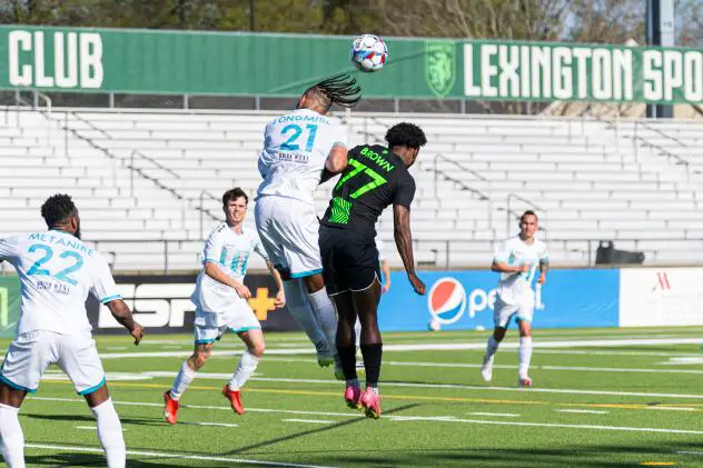 Lexington SC forward Nico Brown (77) fights for a header vs. Spokane Velocity FC