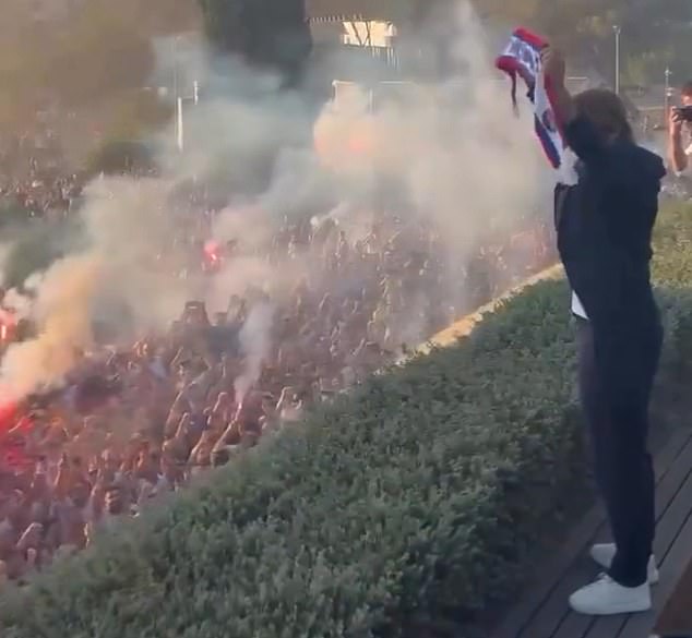 Rakitic received a hero's welcome from thousands of fans as he lifted up the club scarf