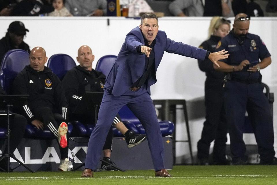 Galaxy head coach Greg Vanney gestures and shouts to his team from the sideline during a 2024 regular season match